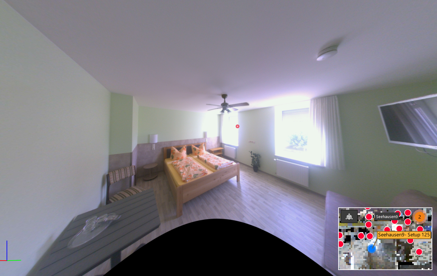 Gästezimmer der Pension in Seehausen mit zwei Fenstern und Doppelbett